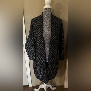 Cozy warm sweater jacket with pockets. Black yarn has a bit of sparkle to it.